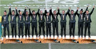  ?? PHOTO: GETTY IMAGES ?? The New Zealand team celebrate winning gold in the Women’s Gold Medal Final match between Australia and New Zealand during Rugby Sevens on day 11 of the Gold Coast 2018 Commonweal­th Games at Robina Stadium on Australia’s Gold Coast.