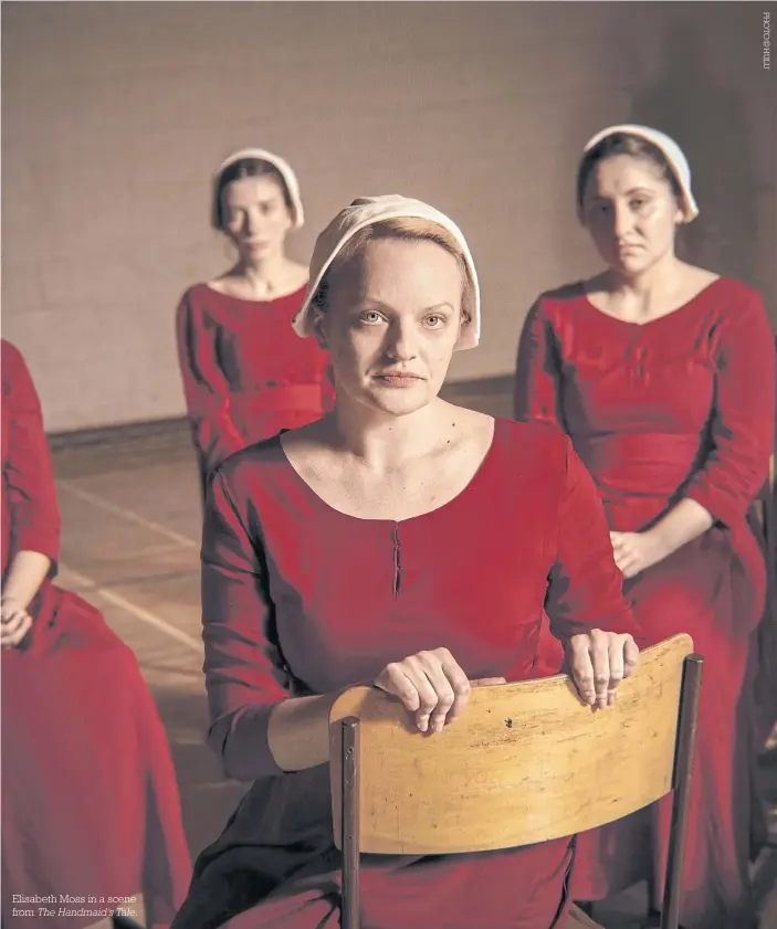  ??  ?? Elisabeth Moss in a scene from The Handmaid’s Tale.