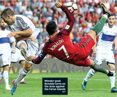  ?? AFP ?? Wonder goal: Ronaldo turns on the style against the Faroe Islands