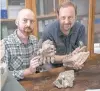  ??  ?? G. BINDELLINI Paleontolo­gists Cristiano Dal Sasso, right, and Simone Maganuco exhibit bones of Razana, an “über-predator.”