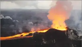  ?? The Associated Press ?? This photo provided by the U.S. Geological Survey shows lava flowing from the Kilauea volcano last Saturday. Good viewing spots on the ground have been closed to the public.