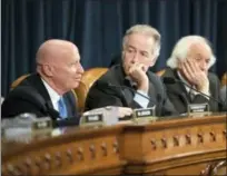  ?? J. SCOTT APPLEWHITE — THE ASSOCIATED PRESS ?? House Ways and Means Committee Chairman Kevin Brady, R-Texas, left, joined by Rep. Richard Neal, D-Mass., the ranking member, and Rep. Sander Levin, D-Mich., offers his manager’s amendment as the GOP tax bill debate enters the final stage on Capitol...
