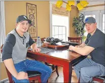  ?? JEREMY FRASER/CAPE BRETON POST ?? Garrett Whittle, left, and Matthew Williams are shown sitting at Whittle’s kitchen table Saturday morning. Whittle was given the M.G. Griffiths Award by the Lifesaving Society of Nova Scotia on March 29. The award was in recognitio­n of Whittle saving...
