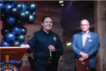  ?? Staff photo by Kelsi Brinkmeyer ?? ■ Kristi Bennett addresses the crowd Wednesday following her pinning ceremony as the first female chief of the Texarkana Arkansas Police Department as Mayor Allen Brown stands behind her at Crossties.