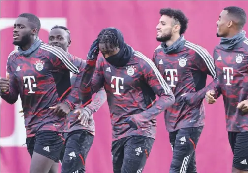  ?? Agence France-presse ?? ±
Bayern Munich’s players warm up during a training session on the eve of the UEFA Champions League match.