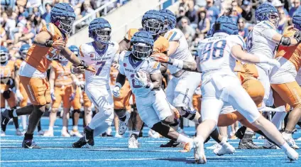  ?? SARAH A. MILLER smiller@idahostate­sman.com ?? Boise State running back Ashton Jeanty carries the ball during the Broncos' spring football game April 20. He led the Mountain West with 1,347 rushing yards last season.