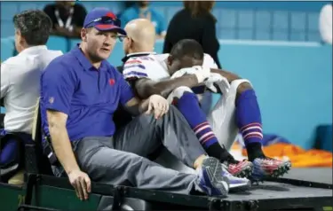  ?? WILFREDO LEE — THE ASSOCIATED PRESS ?? Bills running back LeSean McCoy (25) is driven off the field after he was injured against the Dolphins.