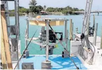  ?? ALLISON BAIRD/COURTESY ?? Jim Culter, Mote staff scientist and Benthic Ecology Program manager, shows a benthic lander used to research the Green Banana and Amberjack blue holes in the Gulf of Mexico.