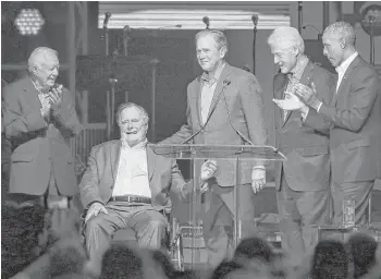  ?? Yi-Chin Lee photos / Houston Chronicle ?? Five former presidents appear together at a concert for hurricane relief Saturday night at Texas A&M. From left are Jimmy Carter, George H.W. Bush, George W. Bush, Bill Clinton and Barack Obama.