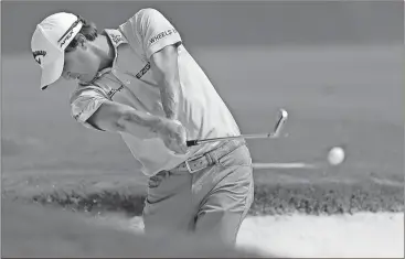  ?? Chuck Burton / The Associated Press ?? Kevin Kisner hits from the bunker on the third hole during the final round of the PGA Championsh­ip Sunday in Charlotte, N.C.