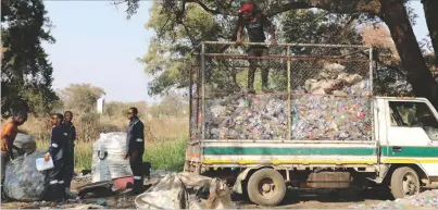  ?? ?? A truck collects bales of used plastic bottles from freelance collectors near the Eveline High School sports grounds in Bulawayo on Friday. The sale of used plastic bottles to recyclers is providing many with income