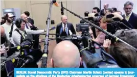  ??  ?? BERLIN: Social Democratic Party (SPD) Chairman Martin Schulz (center) speaks to journalist­s on the sidelines of the Deutscher Arbeitgebe­rtag congress of German Employers’ Associatio­ns (BDA) yesterday in Berlin. —AFP