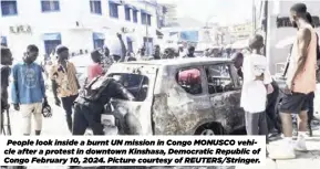  ?? ?? People look inside a burnt UN mission in Congo MONUSCO vehicle after a protest in downtown Kinshasa, Democratic Republic of Congo February 10, 2024. Picture courtesy of REUTERS/Stringer.
