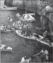  ?? Rick Steves’ Europe/ANDREW WAKELING ?? Boats jockey for position as they get ready to enter the Blue Grotto on the island of Capri in southern Italy.