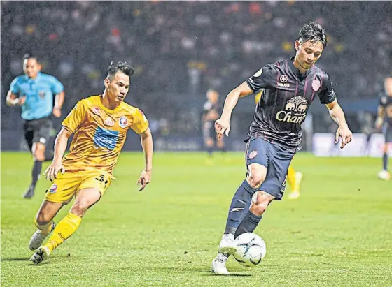  ??  ?? Buriram United’s Kevin Ingreso, right, in action against Port during their Thai League 1 match at Chang Arena last week.