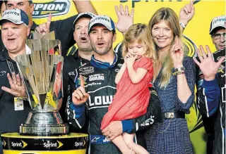  ?? ASSOCIATED PRESS FILE PHOTO ?? Jimmie Johnson, centre, pictured with his wife, Chandra, and his daughter, Genevieve, joins an exodus of popular drivers that began when Jeff Gordon retired after the 2015 season.