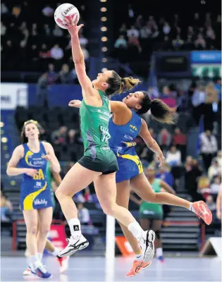  ?? PICTURES: Charlie Crowhurst/getty Images ?? Star performer Imogen Allison reaches in to challenge Celtic Dragons’ Kyra Jones as Team Bath Netball got their new season off to a winning start. Below, Eboni Usorobrown on the court.