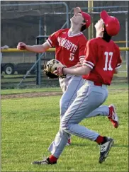  ?? PILOT PHOTO/KATHY HALL ?? Plymouth’s Tanner Feece and Skylar Aker converge for an infield fly ball in Plymouth’s loss at St. Joe.