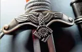  ?? ?? Right: The TeNo leader dagger crossguard was ornate compared to most daggers of the Third Reich (warrelics.eu)