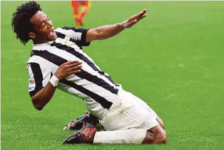  ?? EPA PIC ?? Juventus’ Juan Cuadrado jubilates after scoring the winner against Benevento on Sunday.