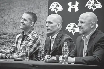  ?? KEVIN RICHARDSON/BALTIMORE SUN ?? From left, Ravens coach John Harbaugh, general manager and executive vice president Eric DeCosta and director of college scouting Joe Hortiz talk to the media at the draft news conference at the Owings Mills facility.