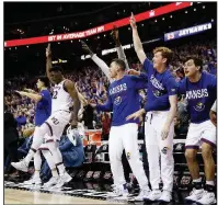  ?? AP/CHARLIE RIEDEL ?? Kansas players celebrate during the second half of the Big 12 Conference Tournament championsh­ip Saturday against West Virginia in Kansas City, Mo. Kansas is among the teams in a top-heavy Midwest Region.