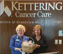  ?? CONTRIBUTE­D ?? Sue Forrest (left) presents hand-knitted Comfee Caps to the patients at the Memorial Sloan Kettering Cancer Center. “Going through chemo treatments can be very scary and lonely. We would love to reach as many patients as God has planned for us.”