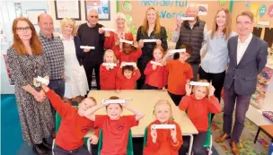  ?? ?? Polehampto­n Infants School pupils were given commemorat­ive rulers to mark the Twyford charity's 300-year anniversar­y. Ref:134967-5