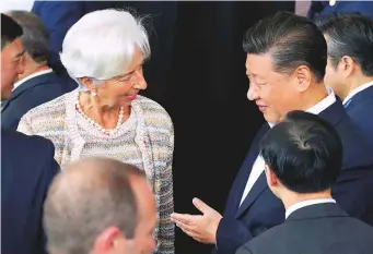  ?? Reuters ?? China’s President Xi Jinping talks with Internatio­nal Monetary Fund (IMF) Managing Director Christine Lagarde at the Asia Pacific Economic Cooperatio­n (Apec) forum in Port Moresby, Papua New Guinea yesterday. In his speech at Apec, Xi said implementi­ng tariffs and breaking up supply chains was “shortsight­ed” and “doomed to failure.” He called for a stronger WTO and defended his Belt and Road Initiative, saying it’s “not a trap as some people have labelled it.”