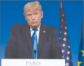  ?? The Associated Press ?? U.S. President Donald Trump pauses during a joint news conference with French President Emmanuel Macron at the Elysee Palace in Paris this past Thursday.