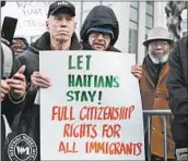  ?? SPENCER PLATT/GETTY ?? Demonstrat­ors voice their support for Haitians this week at the courthouse in the New York borough of Brooklyn.