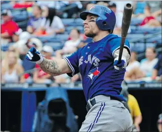  ?? Scott Cunningham, Getty Images ?? Toronto Blue Jays third baseman Brett Lawrie hits a home run off Atlanta Braves pitcher Livan Hernandez during the sixth inning of the Jays’ 12-4 win Sunday afternoon at Turner Field in Atlanta.