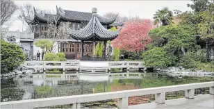  ??  ?? The upturned corners of the Moon Locking Pavilion are softened by the red and green foliage of neighbouri­ng trees. When the moon is full, you can see its reflection in the the middle of the lake, locked in by the shadow of the pavilion. This garden...