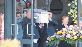  ??  ?? Olivia’s coffin is carried from the church. Pictures: RICHARD GOSLING