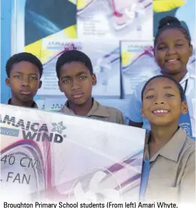  ?? ?? Broughton Primary School students (From left) Amari Whyte, Rodger Williams, Anise Anderson and Jordan Subaxon were elated to receive fans for their classrooms donated by the Sandals Foundation.