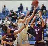  ??  ?? At left, Spring-Ford’s Emily Tiffan (11) tries for a layup against Abington defenders Abril Bowser, left, and Jaida Helm. At right, Spring-Ford’s Mac Pettinelli looks to drive along the baseline against Abington.