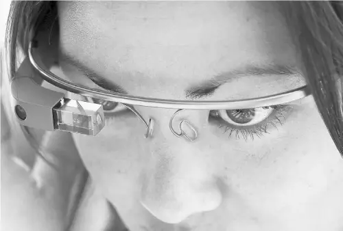  ?? JUSTIN SULLIVAN/ GETTY IMAGES ?? Google Glass, now undergoing testing, contains a hidden computer with a tiny display screen above the right eye. The device’s ability to take photos and shoot videos almost instantly has raised privacy concerns, and it has been banned from casinos and...
