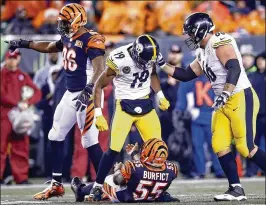  ?? GETTY IMAGES ?? Pittsburgh receiver JuJu Smith-Schuster (19) was suspended one game for a blindside block on Cincinnati linebacker Vontaze Burfict. Bengals safety George Iloka also was suspended a game for a subsequent hit on Steelers wideout Antonio Brown.