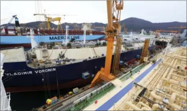  ?? AHN YOUNG-JOON — THE ASSOCIATED PRESS ?? Constructi­on continues on large-sized liquefied natural gas (LNG) carriers at the Daewoo Shipbuildi­ng and Marine Engineerin­g facility in Geoje Island, South Korea.