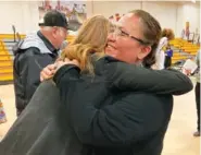  ?? AP PHOTO/SUSAN MONTOYA BRYAN ?? Chief school administra­tor Willinda Castillo hugs U.S. Rep. Melanie Stansbury of New Mexico following a celebratio­n of $90 million in federal funds for a new school at To’Hajiilee, New Mexico.