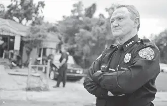  ?? JOE RAEDLE, GETTY IMAGES ?? John Timoney stands near a Miami home raided by police in 2006, when he served as the city’s police chief. The man dubbed “America’s Best Cop” by Esquire died last week.