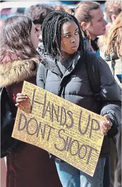  ?? PHOTOGRAPH­Y BY BARRY GRAY, THE HAMILTON SPECTATOR ?? Signs spell out grim messages Friday as Hamilton students leave their schools to join the war on guns and assault weapons. Across the United States and Canada, it was National School Walkout Day.