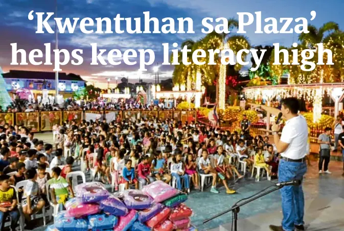  ??  ?? SUNSET STORIES The public library of Imus, Cavite, conducts its regular storytelli­ng for children at the historic plaza, the city’s center of government and economic activities. Volunteer students from Cavite State University (top left) also hold reading sessions at the public library for out-of-school children.