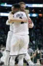  ?? ELISE AMENDOLA — THE ASSOCIATED PRESS ?? Villanova’s Donte DiVincenzo, rear, and Jalen Brunson celebrate their win over Texas Tech in an NCAA men’s college basketball tournament regional final, Sunday in Boston. Villanova won 71-59 to advance to the Final Four.