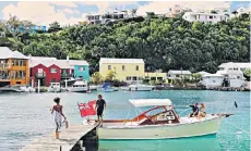  ?? ?? Docking station: Bermuda’s colourful houses and aquamarine waters will lift spirits