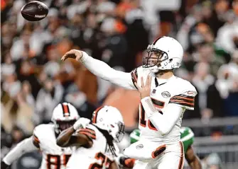  ?? Nick Cammett/Getty Images ?? Joe Flacco surpassed 300 pass yards in a fourth straight game, throwing for three touchdowns as he led the Browns to a 37-20 win over the Jets on Thursday that Cleveland a berth in the playoffs.