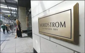  ?? TED S. WARREN / AP FILE (2019) ?? Shoppers come and go from Nordstrom Inc.’s f lagship store in downtown Seattle. Nordstrom and other retailers that cater to America’s upper middle class have experience­d weakening results.