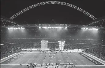  ?? AP PHOTO ?? Wembley Stadium in London is shown prior to the start of an NFL game. Jacksonvil­le Jaguars owner Shahid Khan has made an offer to buy Wembley Stadium from the English Football Associatio­n, increasing the prospect of an NFL franchise in London.