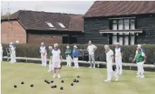  ??  ?? They’re glad to be back on the green at Horsham Bowling Club