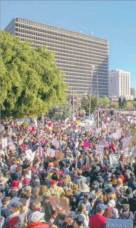  ??  ?? THE DAY AFTER President Trump’s inaugurati­on, protesters gathered in downtown Los Angeles and other cities across the country